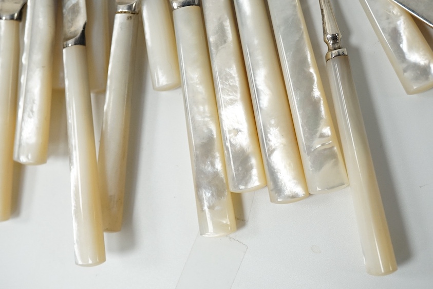 Eleven pairs of George V mother of pearl handled silver dessert eaters and one knife to match, Frederick C Asman & Co, Sheffield, 1930, knife 18.1cm. Condition - fair to good